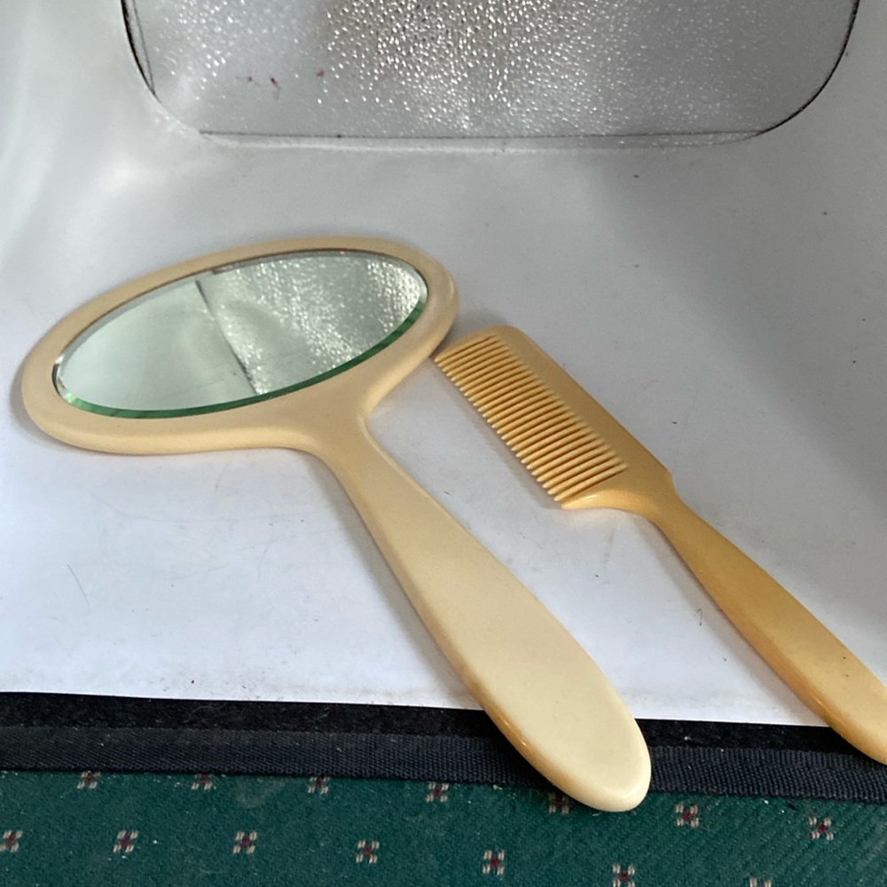 Mirror &comb in vanilla color plastic mirror 13.75” long 7.75” widest comb 9.75”